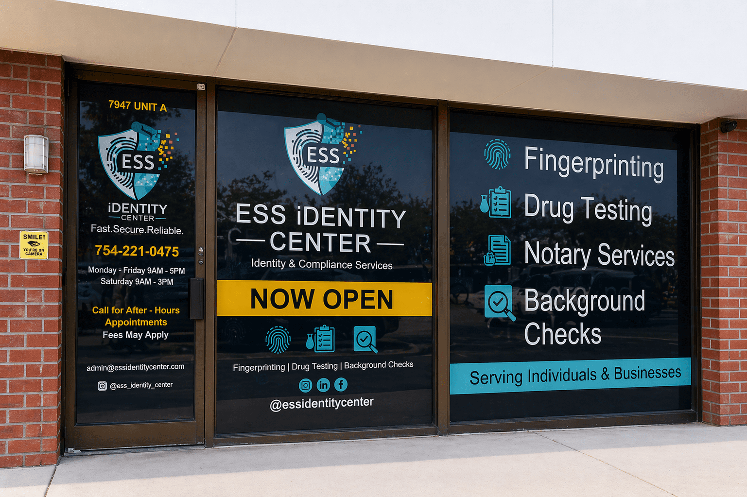 Window signage for ESS Identity Center offering fingerprinting and background checks.